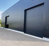 PORTES DE GARAGE SECTIONNELLES A REFOULEMENT PLAFOND INDUSTRIELLES